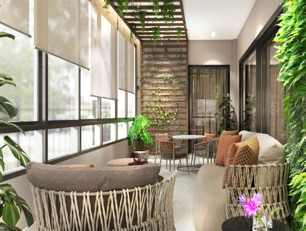 Luxury indoor terrace design featuring a vertical green wall, wooden trellis ceiling with ivy, and modern woven outdoor furniture.