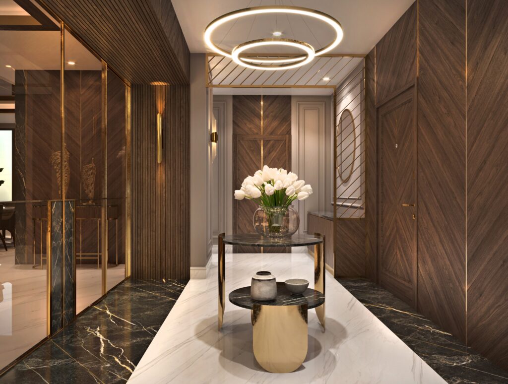 Luxury modern foyer design with chevron wood paneling, marble floors, and a gold circular halo chandelier.
